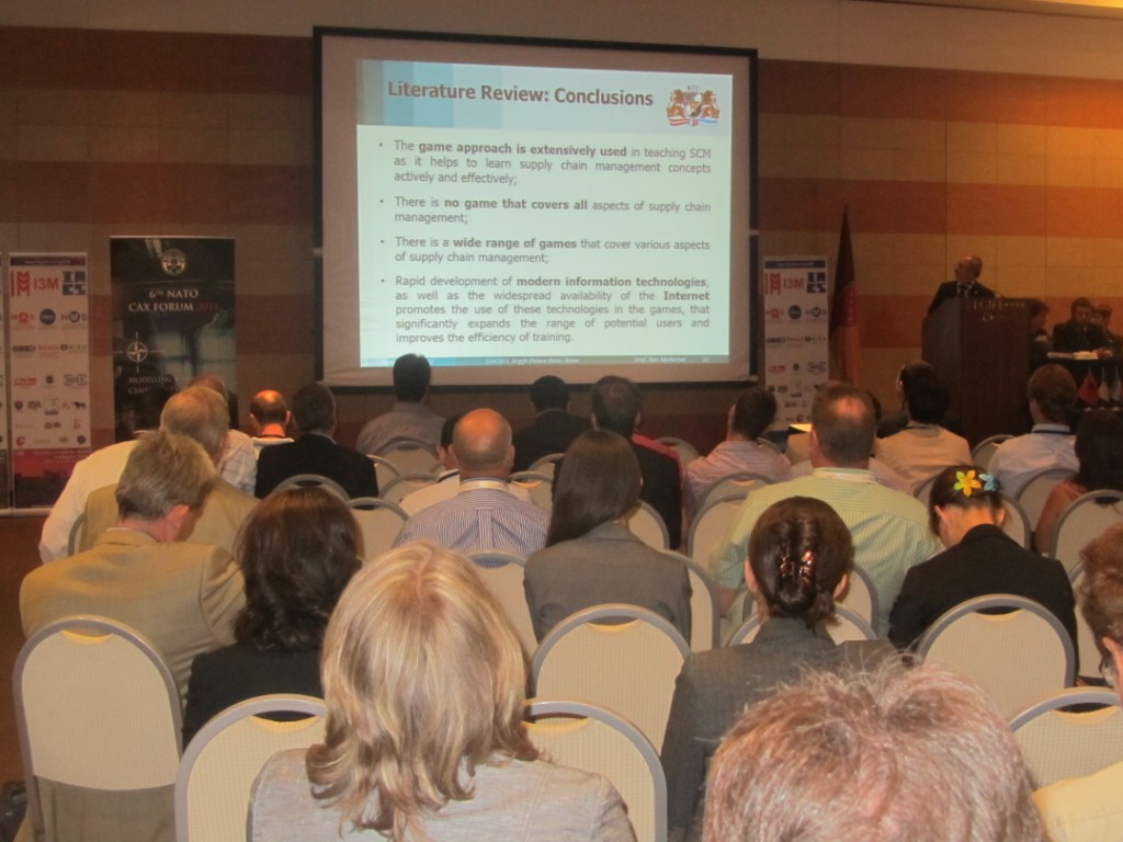 	I3M2011 / CAX Forum Opening - Plenary Speakers: Prof.Yuri Merkuryev presents the use of M&S in Supply Chain Management	