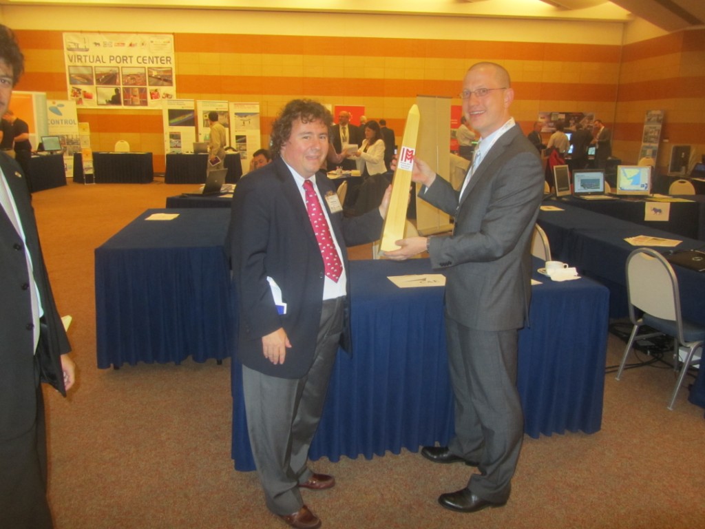 	I3M2011 / CAX Exhibition - Prof.Bruzzone awards CAE with I3M Industrial Sponsor Obelisk Award	
