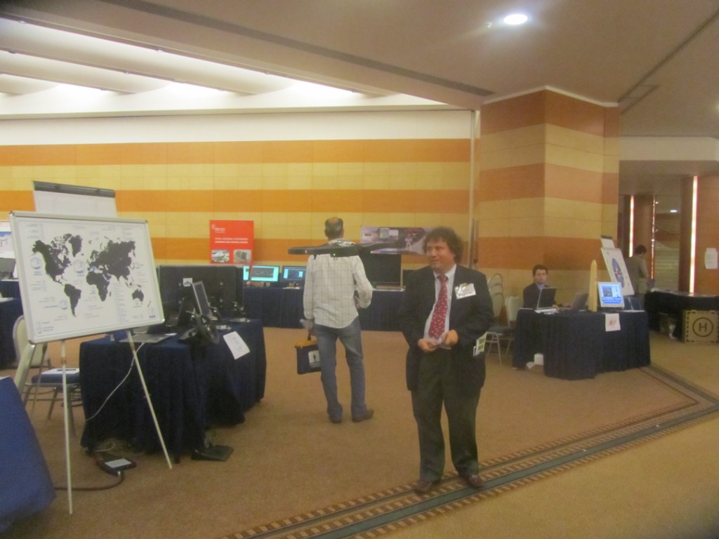 	I3M2011 - Prof.Bruzzone flying a Simulation Team UAV in the I3M / CAX Forum Exhibition Area	