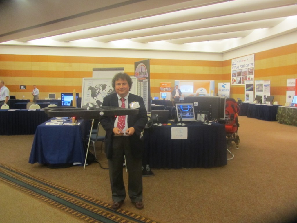 	I3M2011 - Prof.Bruzzone flying a Simulation Team UAV in the I3M / CAX Forum Exhibition Area	